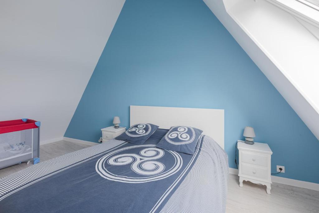 Postel nebo postele na pokoji v ubytování Gîte de la Marina dans la presqu'île de Lézardrieux