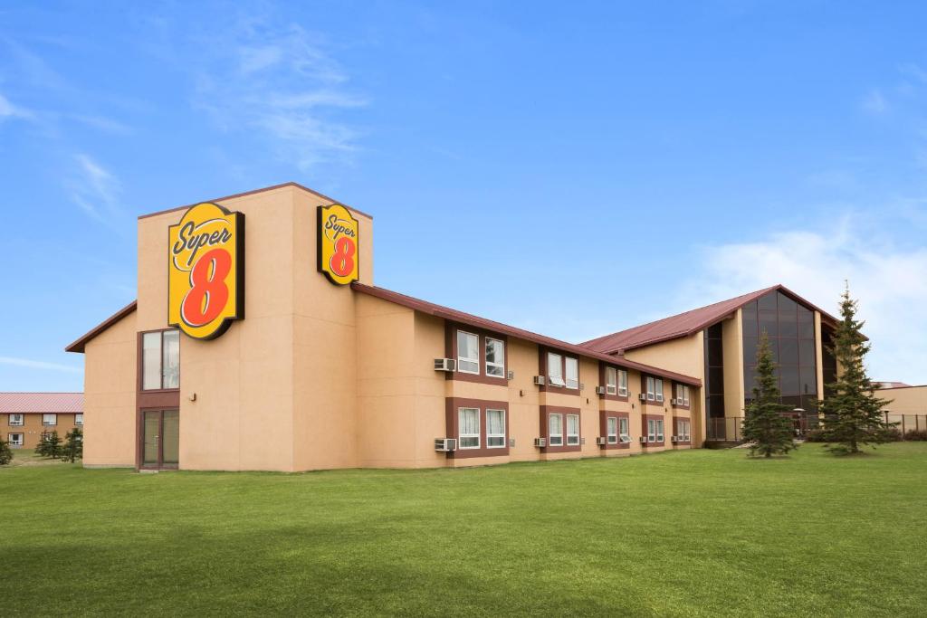 a hotel with a sign on the side of it at Super 8 by Wyndham Sherwood Park/Edmonton Area in Sherwood Park