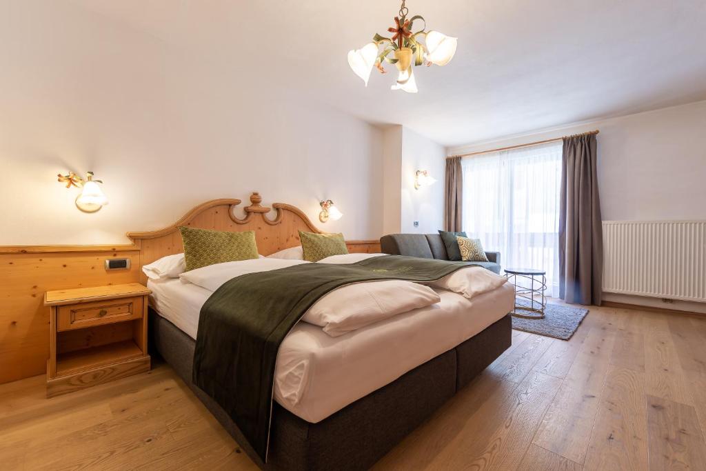 Łóżko lub łóżka w pokoju w obiekcie B&B Grüne Laterne - Lanterna Verde