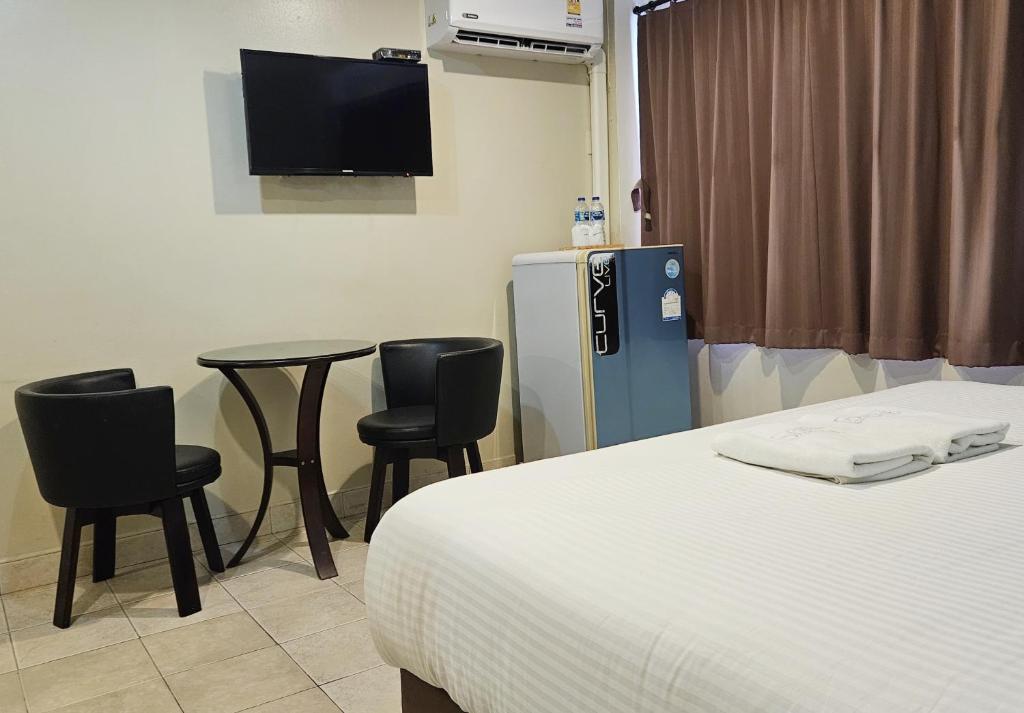 Postel nebo postele na pokoji v ubytování Pacific Residence