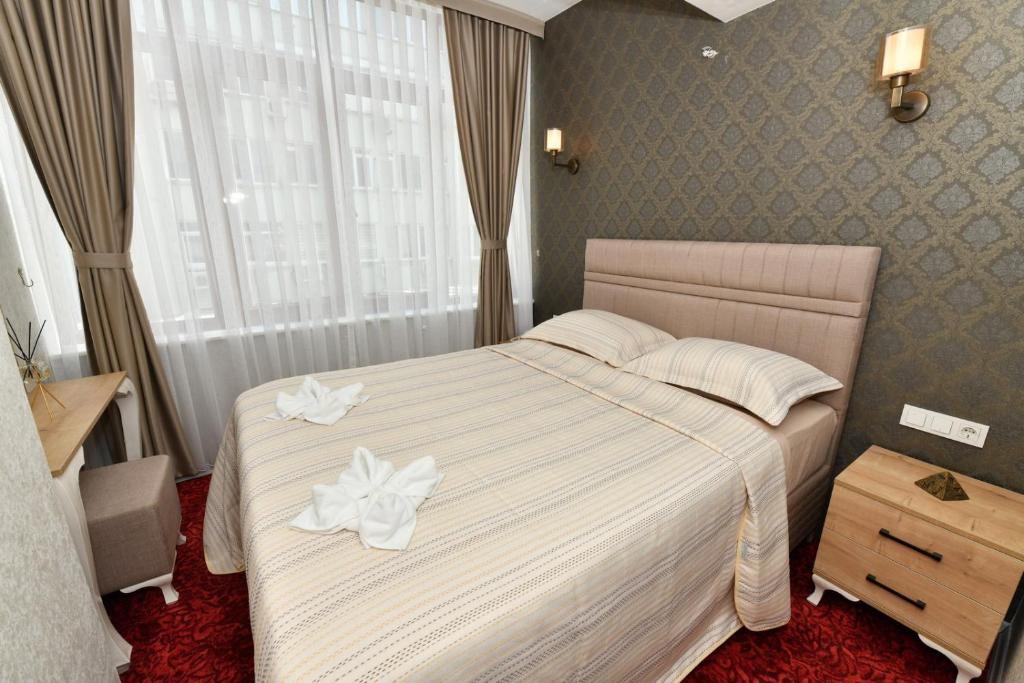 Postel nebo postele na pokoji v ubytování Sea Moon Hotel