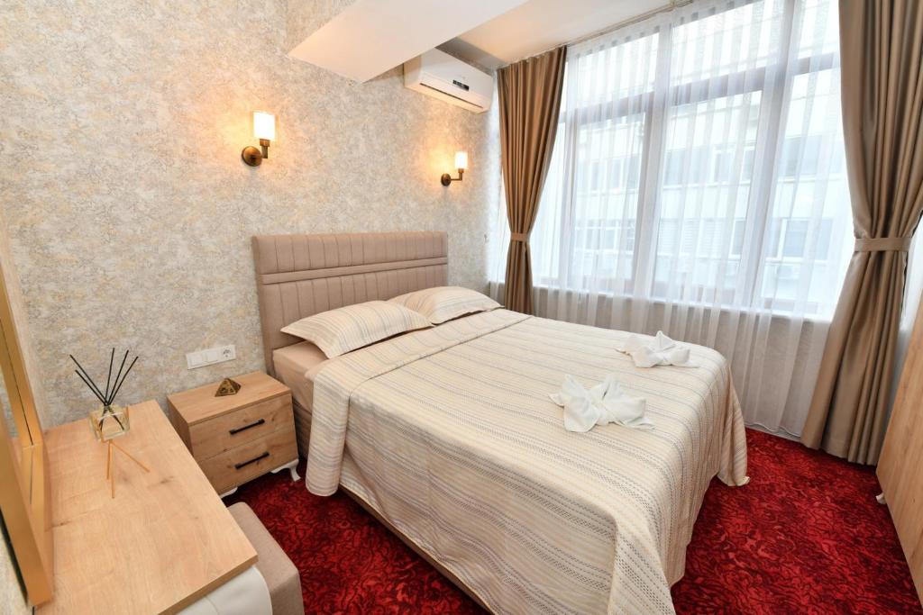 Postel nebo postele na pokoji v ubytování Sea Moon Hotel
