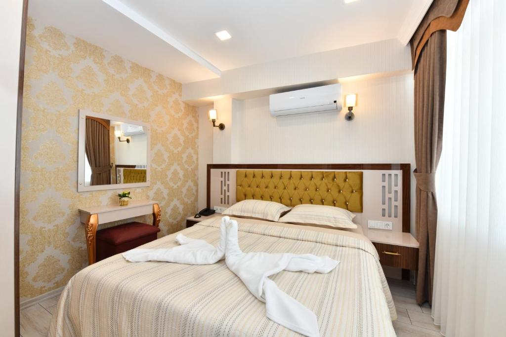 Postel nebo postele na pokoji v ubytování Sea Moon Hotel