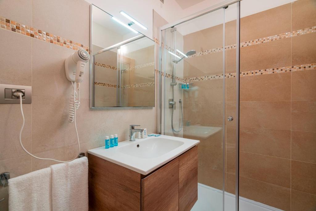 Een badkamer bij Hotel Portoconte