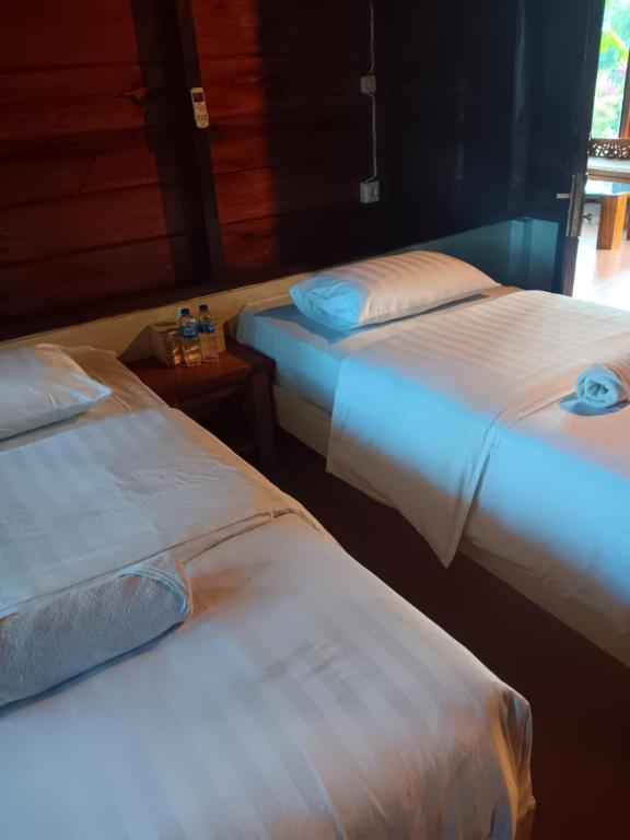 Postel nebo postele na pokoji v ubytování Oinan Guest House