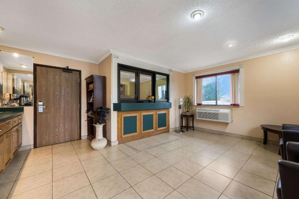 a large room with a kitchen and a door at Econo Lodge Spotsylvania Town Center in Fredericksburg