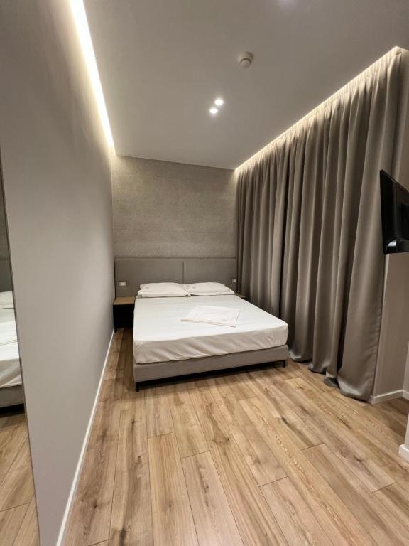 Postel nebo postele na pokoji v ubytování Enzo rooms & apartment Blloku