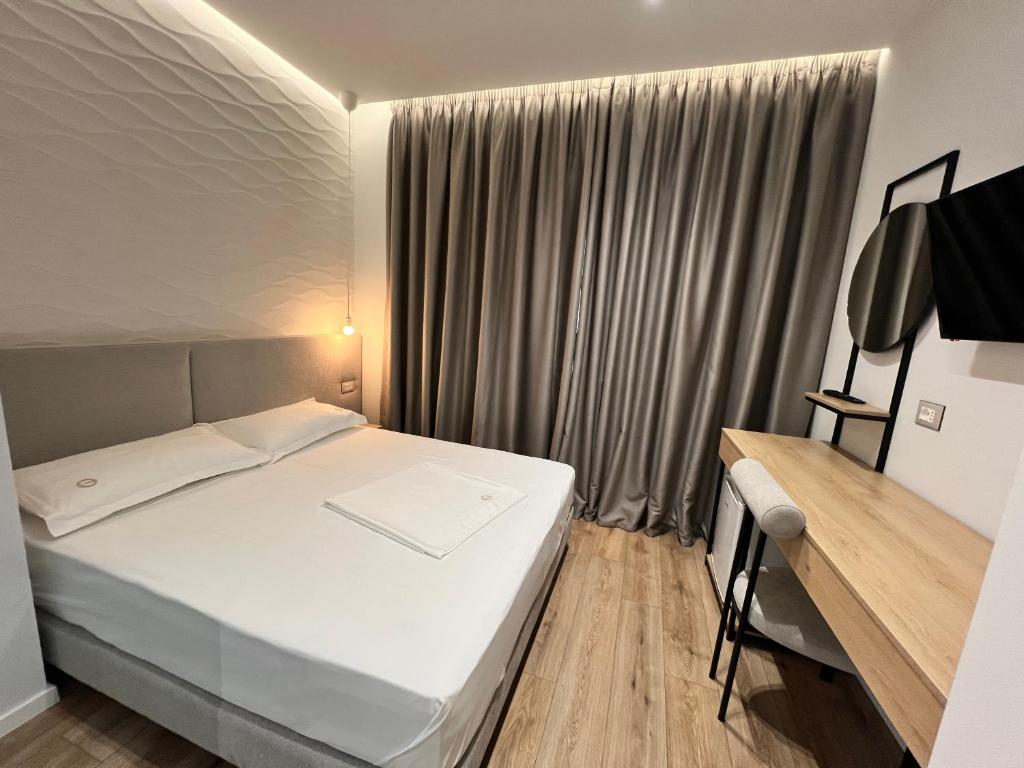 Postel nebo postele na pokoji v ubytování Enzo rooms & apartment Blloku