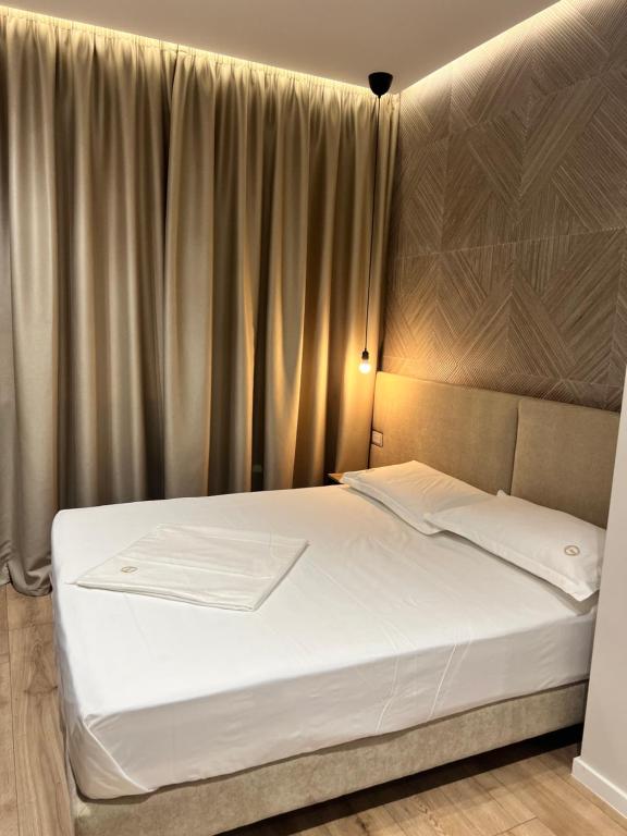 Postel nebo postele na pokoji v ubytování Enzo rooms & apartment Blloku