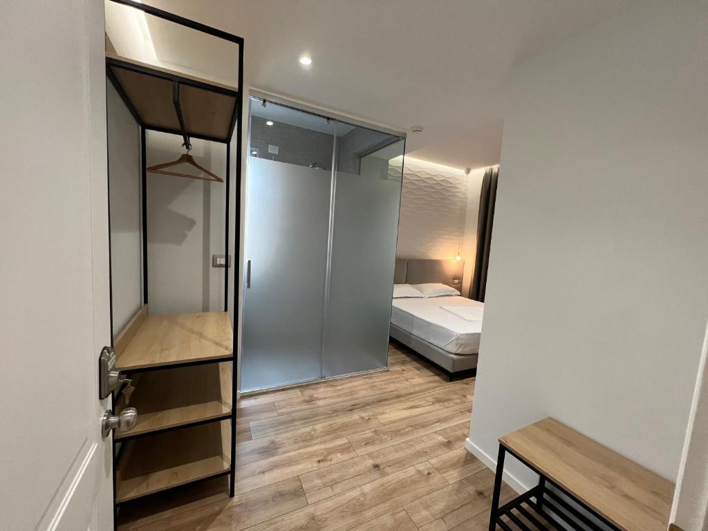 Postel nebo postele na pokoji v ubytování Enzo rooms & apartment Blloku