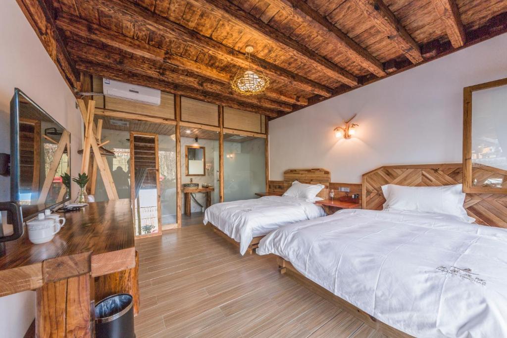 Postel nebo postele na pokoji v ubytování Swallow Nest Guesthouse