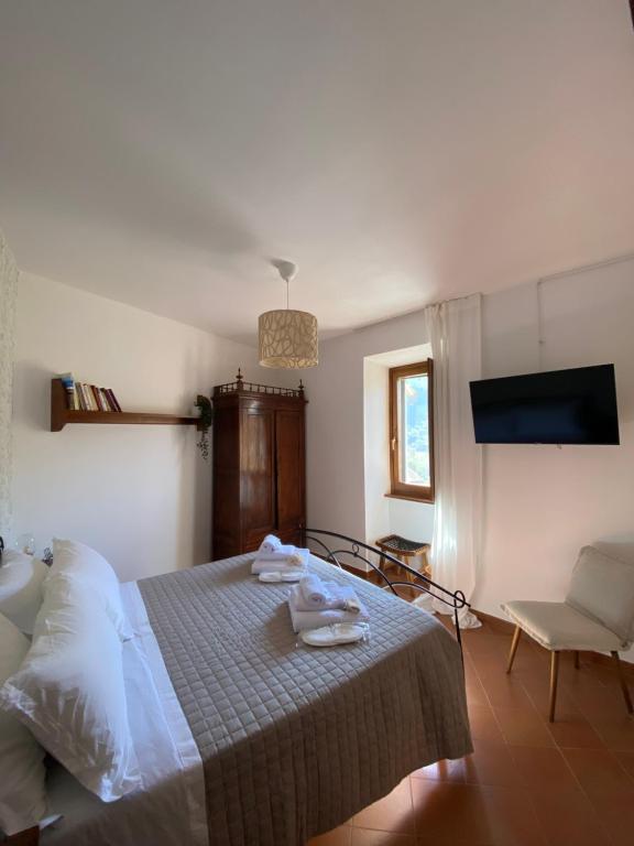 Postel nebo postele na pokoji v ubytování Il Tripode - Le Dimore del Bordone