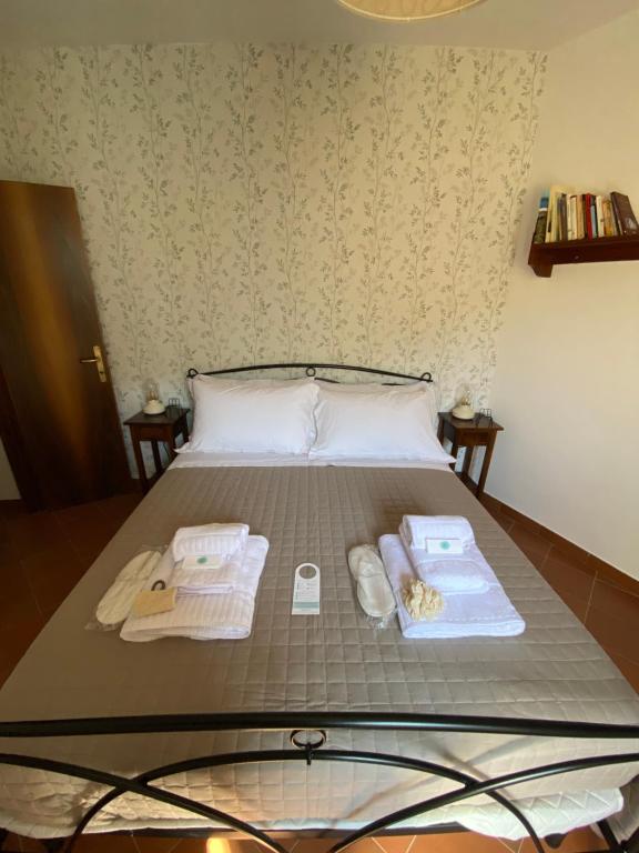 Postel nebo postele na pokoji v ubytování Il Tripode - Le Dimore del Bordone