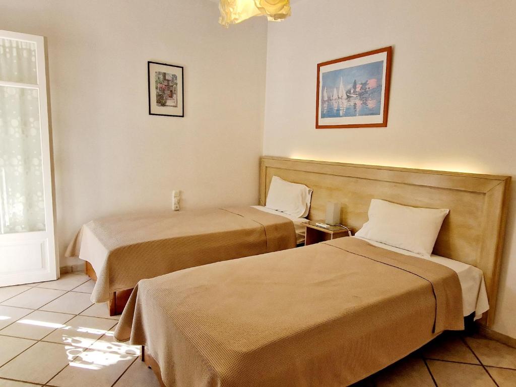 Posteľ alebo postele v izbe v ubytovaní Panorama Apartments Fiscardo
