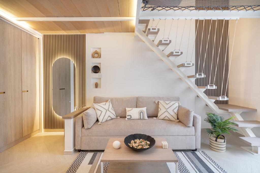 a living room with a couch and a staircase at Unique Loft design in JVC with relaxing in Dubai