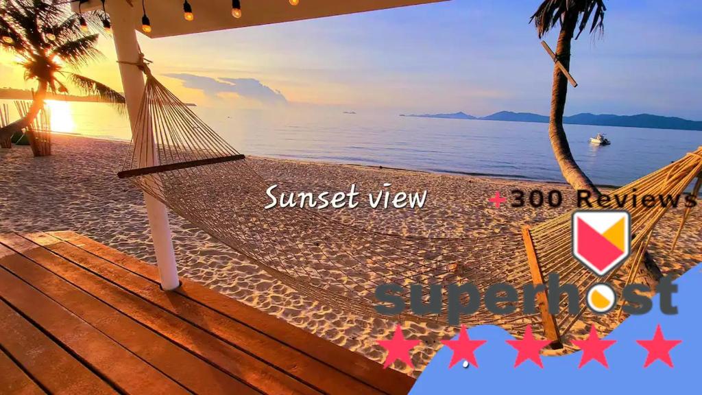 a hammock on a beach with a sunset view at -20 percent OFF! Private BEACH FRONT house Sunset in Koh Samui