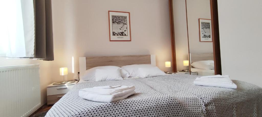 Posteľ alebo postele v izbe v ubytovaní Budapest Csaszar Hotel