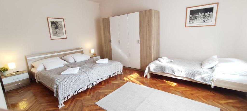 Posteľ alebo postele v izbe v ubytovaní Budapest Csaszar Hotel