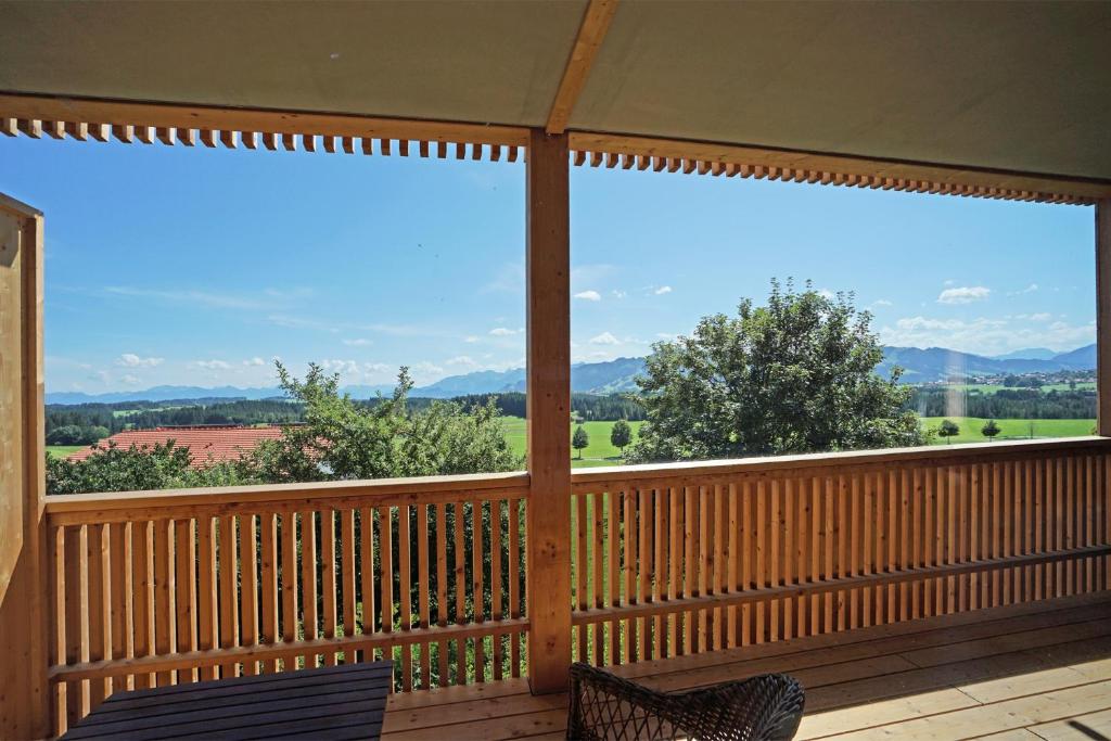 a screened in porch with a view of the mountains at Casa Montagna in Oy-Mittelberg