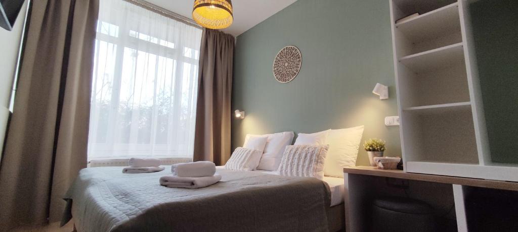 Posteľ alebo postele v izbe v ubytovaní Budapest Csaszar Hotel