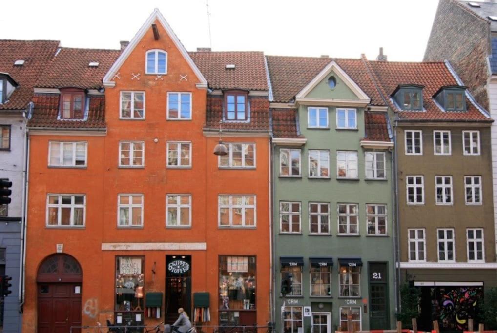 a row of colorful buildings in a city at Indre by in Copenhagen