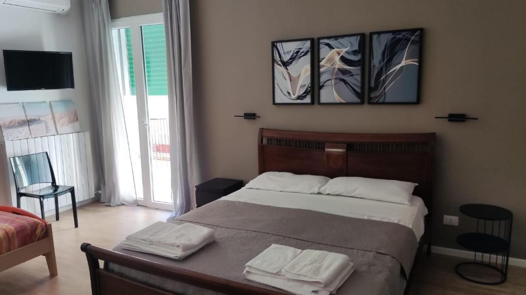 Postel nebo postele na pokoji v ubytování Dimora Rudiae Lecce