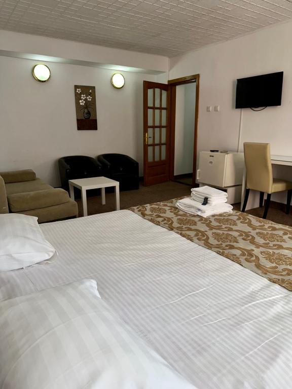 Postel nebo postele na pokoji v ubytování Darin Hotel