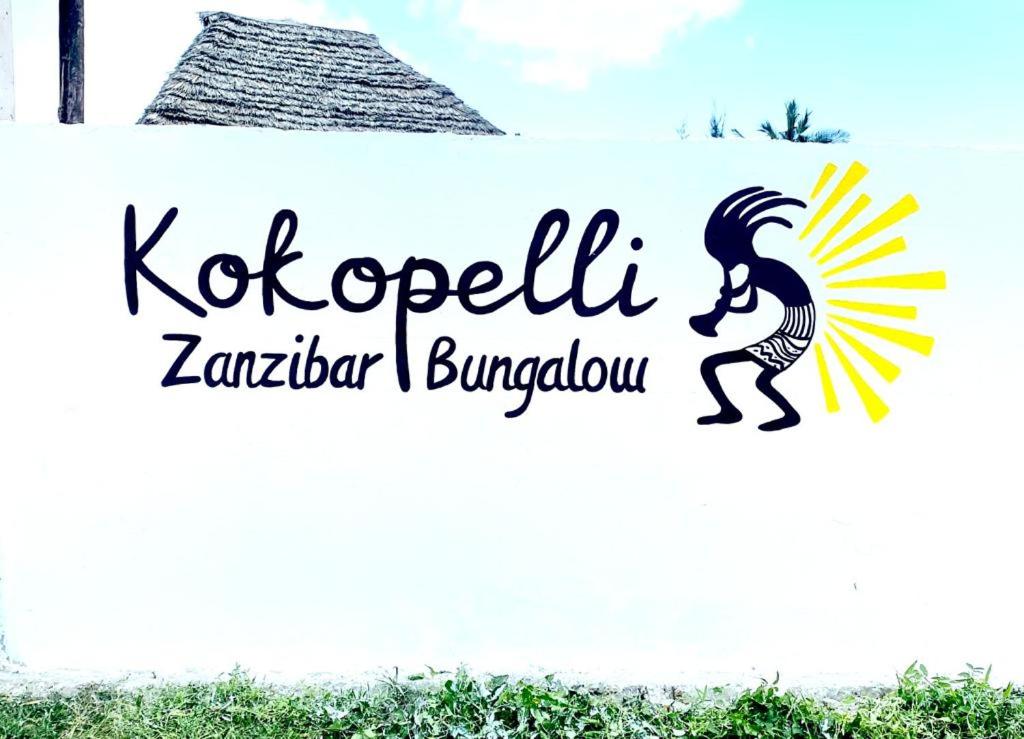 a sign that reads kazakhstan zamboanga burrow at Kokopelli Bungalows in Nungwi