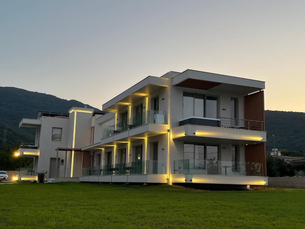 a large apartment building with a large grassy yard at Balance Accommodation in Stavros