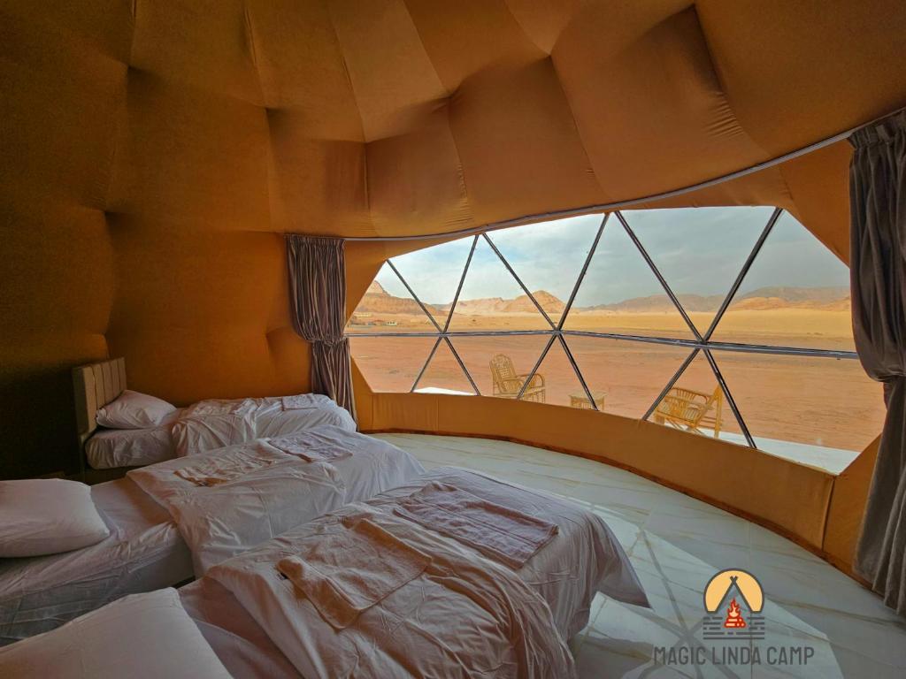 Postel nebo postele na pokoji v ubytování wadi rum,Linda Camp