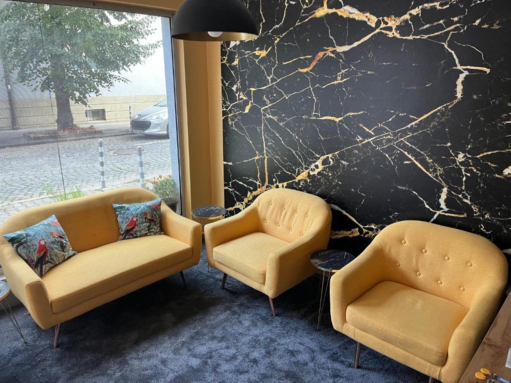 two chairs and two chairs in a lobby at APARTHOTEL VICTORY SOFIA in Sofia