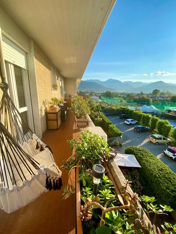 a balcony of a building with a view of a river at Relax fra il mare e le Alpi Apuane a Casa Gabri in Marina di Carrara