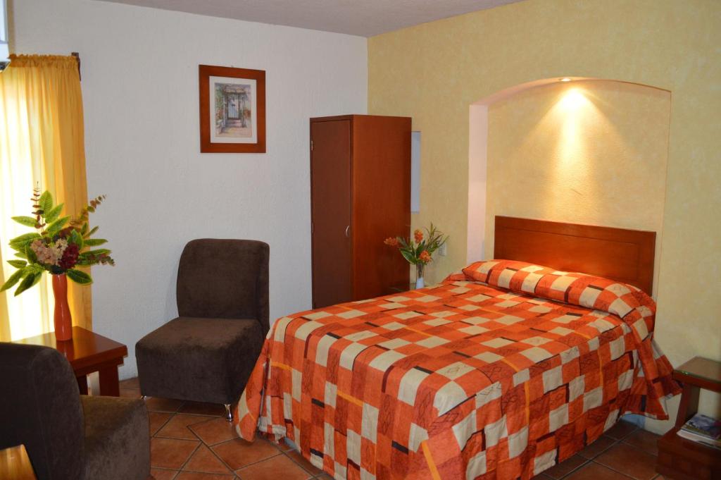 Postel nebo postele na pokoji v ubytování Hotel La Rienda Mision Tequillan
