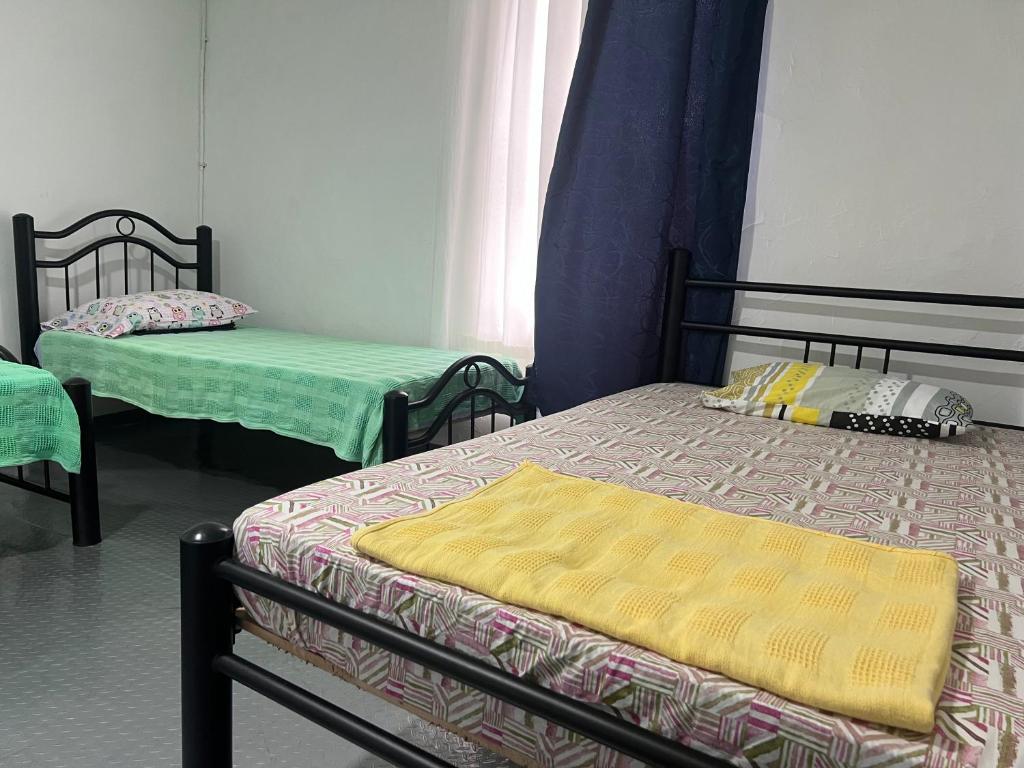 Postel nebo postele na pokoji v ubytování Helena Hostel