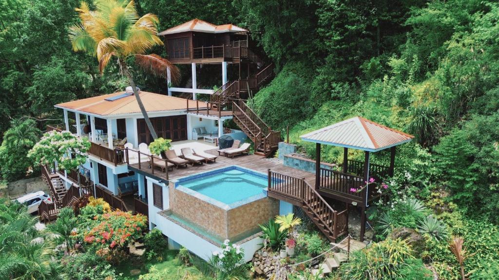 an aerial view of a house with a swimming pool at Moringa Villa Master Suite in Soufrière