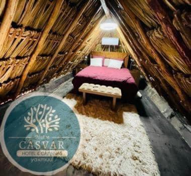 a room with a bed and a sign in a yurt at Cabañas Casvar in Balcheil