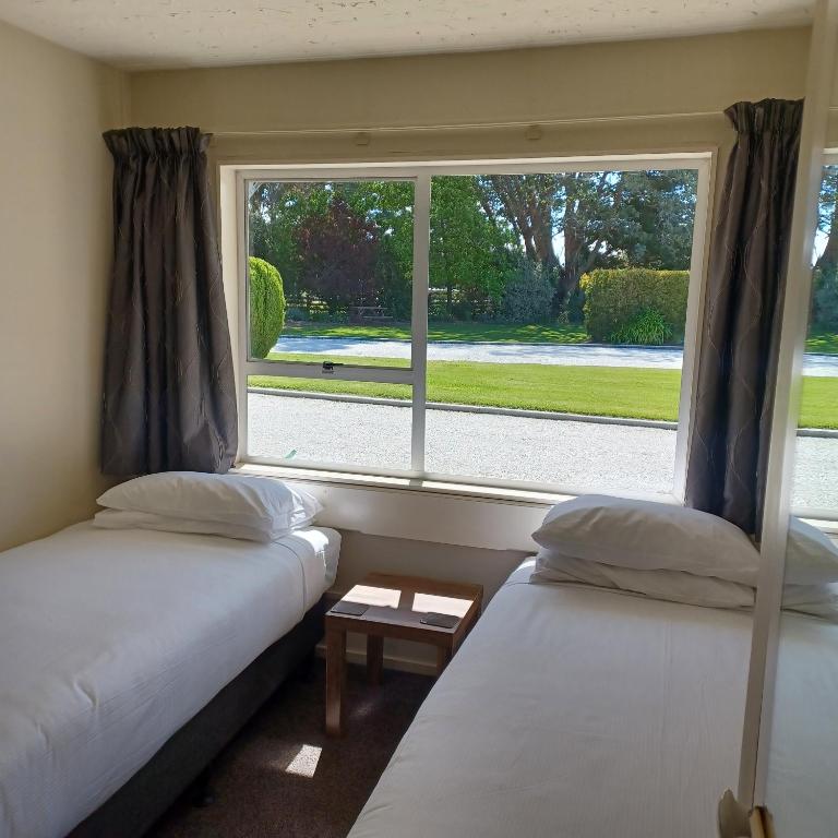 Postel nebo postele na pokoji v ubytování Flaxbourne Motels