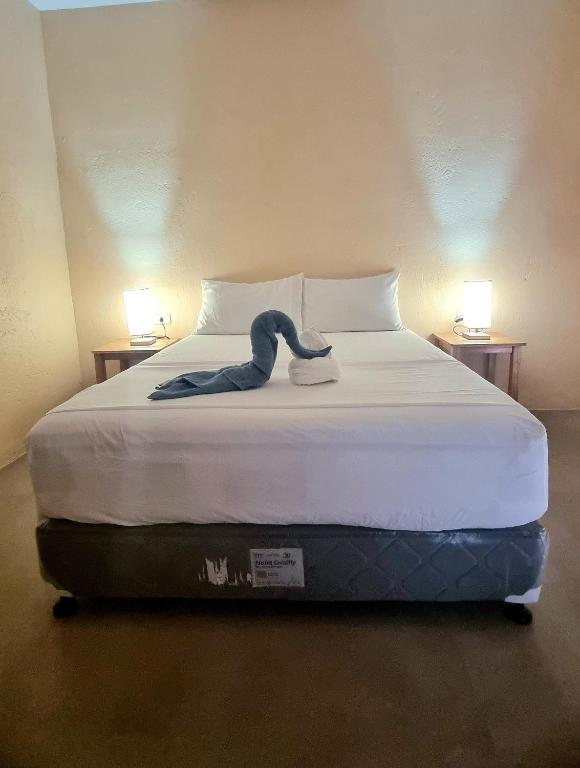 Postel nebo postele na pokoji v ubytování Tiki Bantayan Cebu Tourist Inn Inc