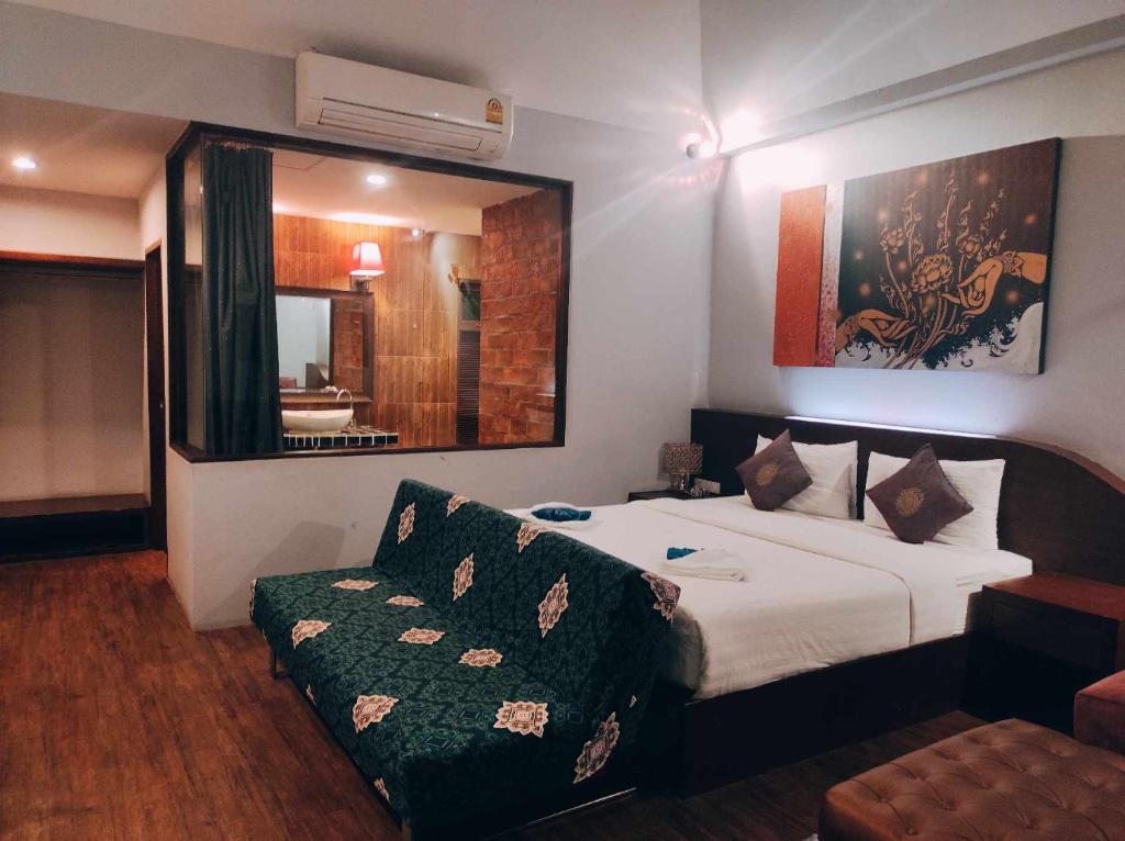 Postel nebo postele na pokoji v ubytování Foresto Sukhothai Guesthome