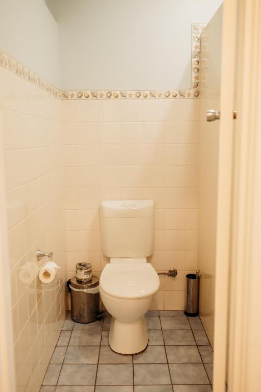 a bathroom with a white toilet in a room at Ceduna Foreshore Hotel Motel in Ceduna