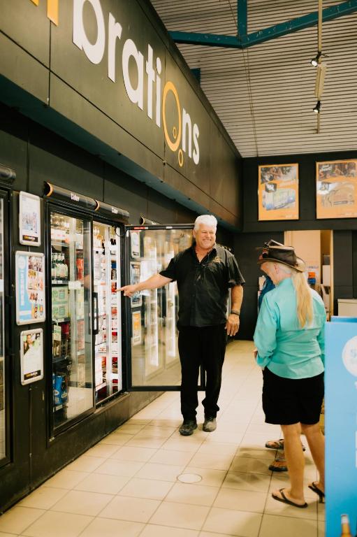 a man and a woman standing in front of a store at Ceduna Foreshore Hotel Motel in Ceduna
