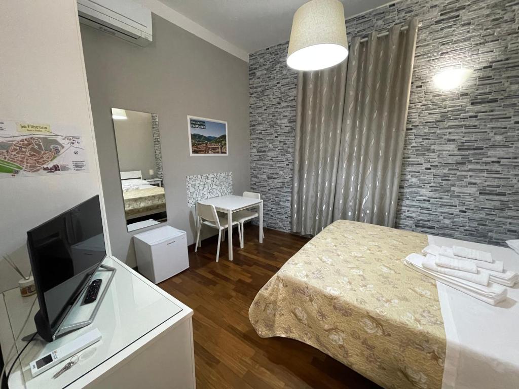 TV a/nebo společenská místnost v ubytování Rooms & Breakfast La Filigrana