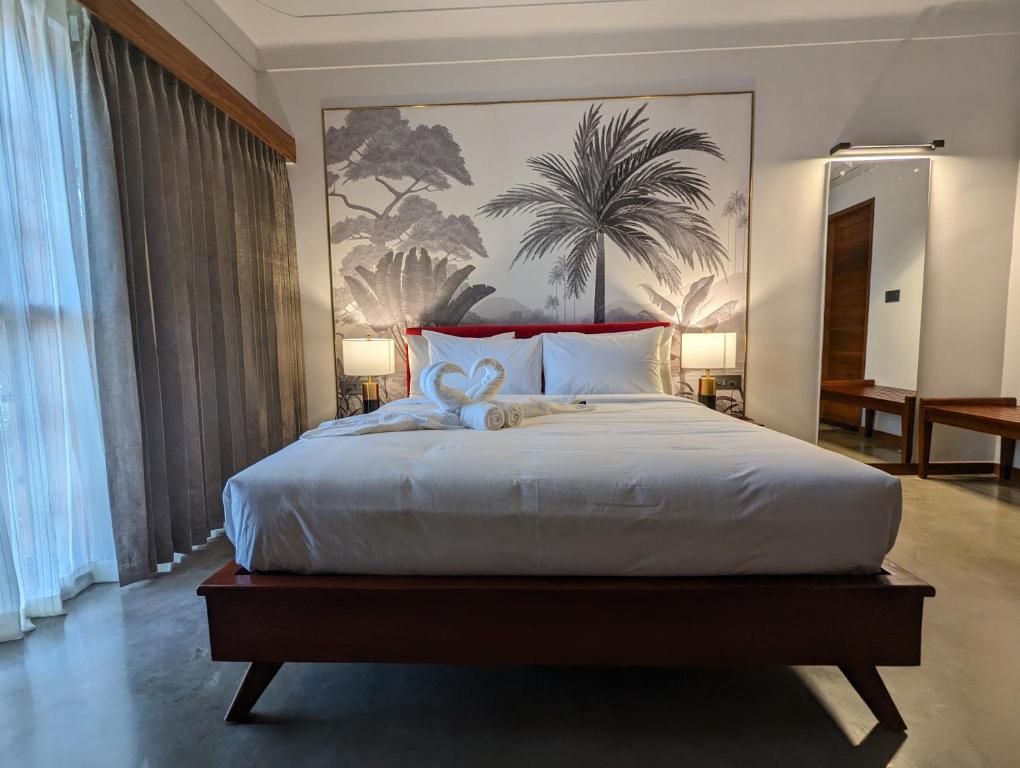 Postel nebo postele na pokoji v ubytování Prasanthi Hotel