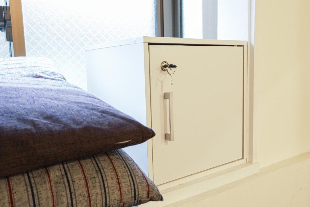 Voodi või voodid majutusasutuse Hostel Lodging Tokyo Uguisudani toas