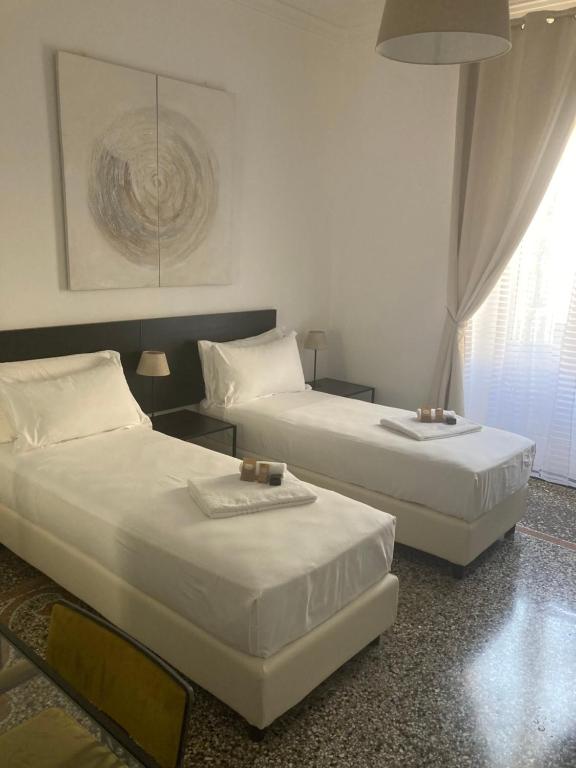 Postel nebo postele na pokoji v ubytování Brignole Rooms