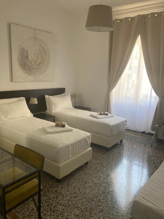 Postel nebo postele na pokoji v ubytování Brignole Rooms