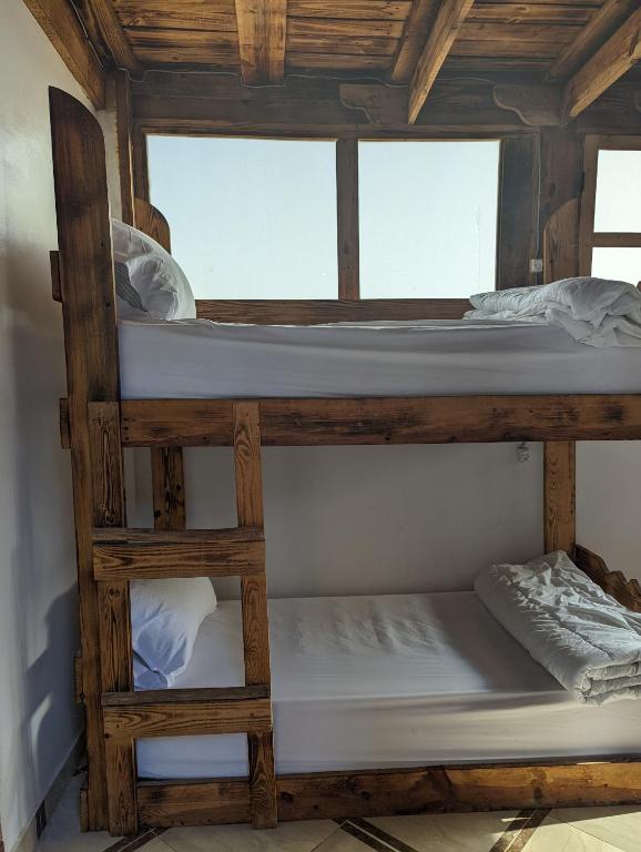 Postel nebo postele na pokoji v ubytování darna surf house anza