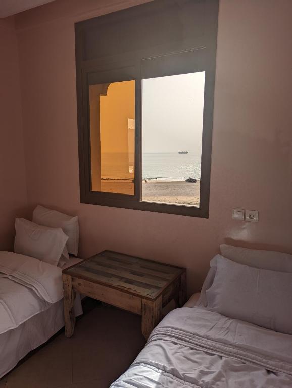 Postel nebo postele na pokoji v ubytování darna surf house anza