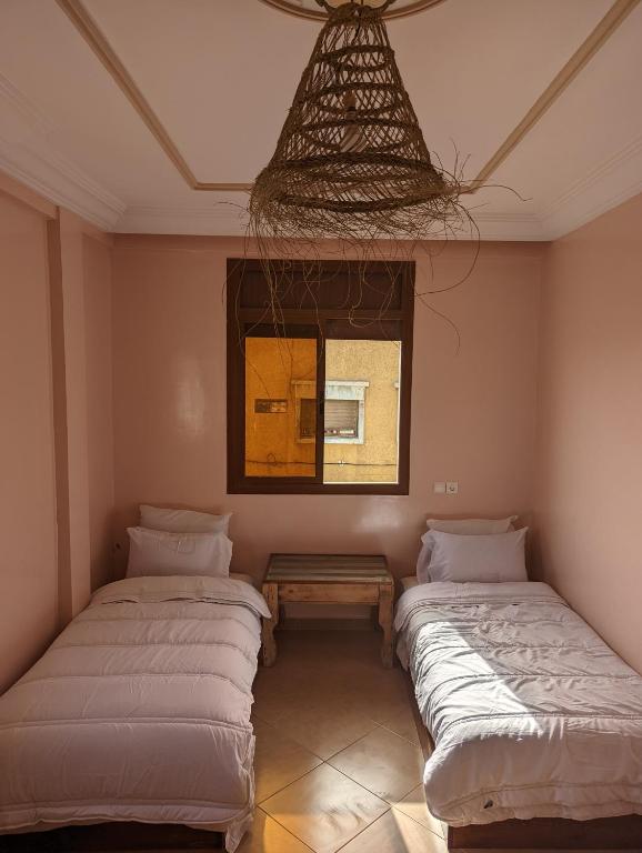 Postel nebo postele na pokoji v ubytování darna surf house anza