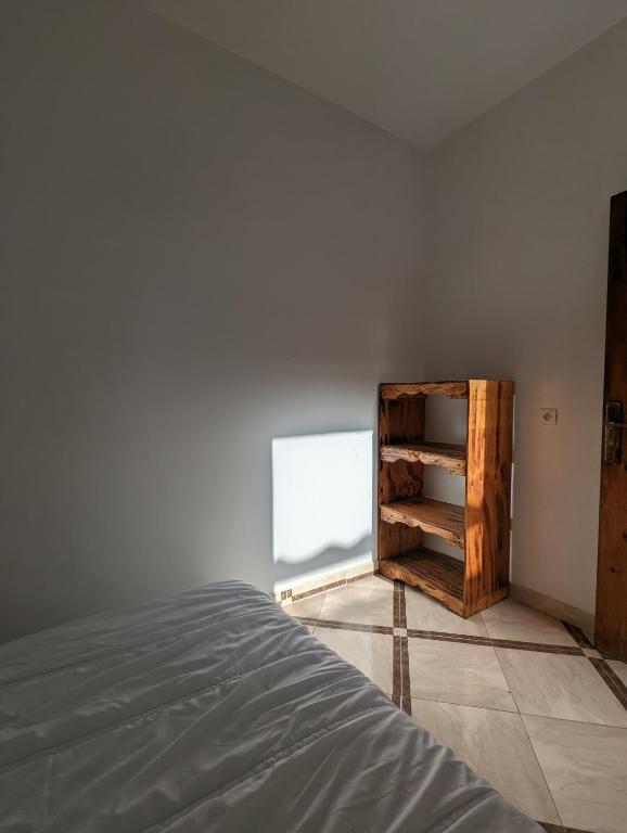Postel nebo postele na pokoji v ubytování darna surf house anza